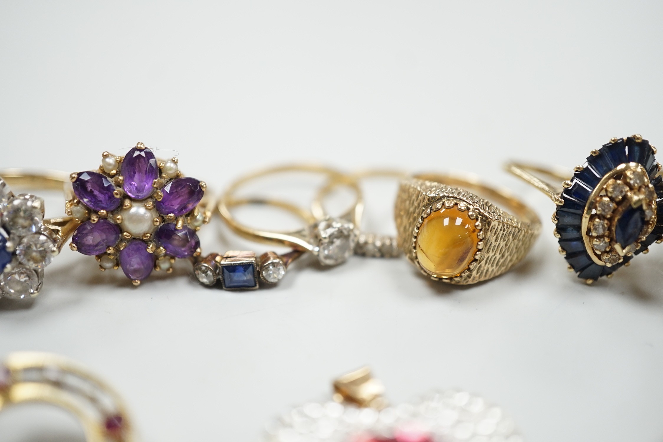 Eight assorted mainly modern 9ct gold and gem set dress rings, including amethyst and split pearl cluster, gross weight 30.7 grams, a 15ct, ruby and seed pearl set open work circular brooch, gross 2.6 grams, pair of 9ct,